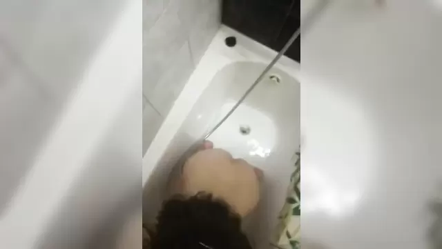 Uzbek babe gives a blowjob to her friend in the bathroom