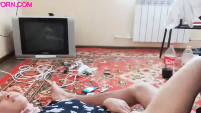 Clothed Uzbek woman has sex with a man on the floor